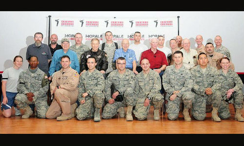Neil Armstrong (second from right, middle row) visits with USAF members in Southwest Asia, 2010.